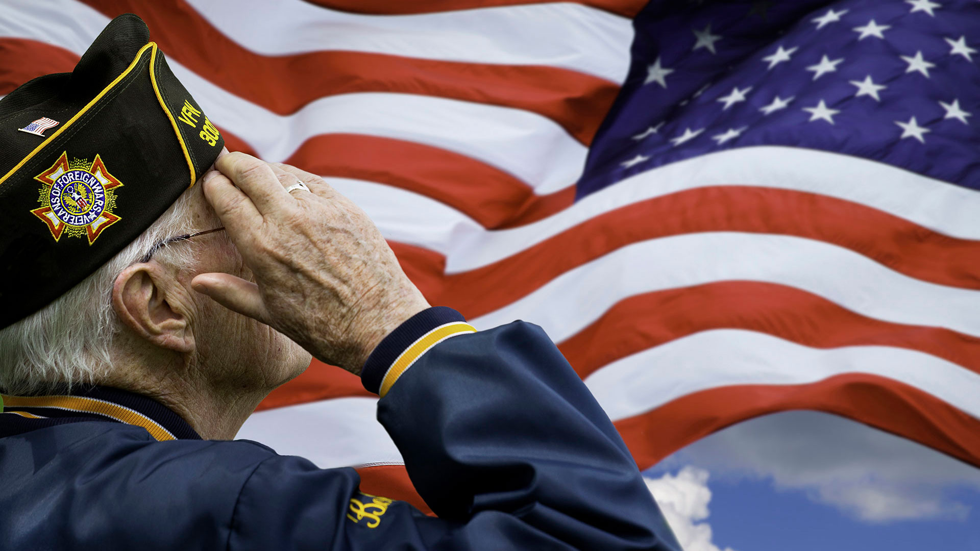 A Veteran saluting to the American flag